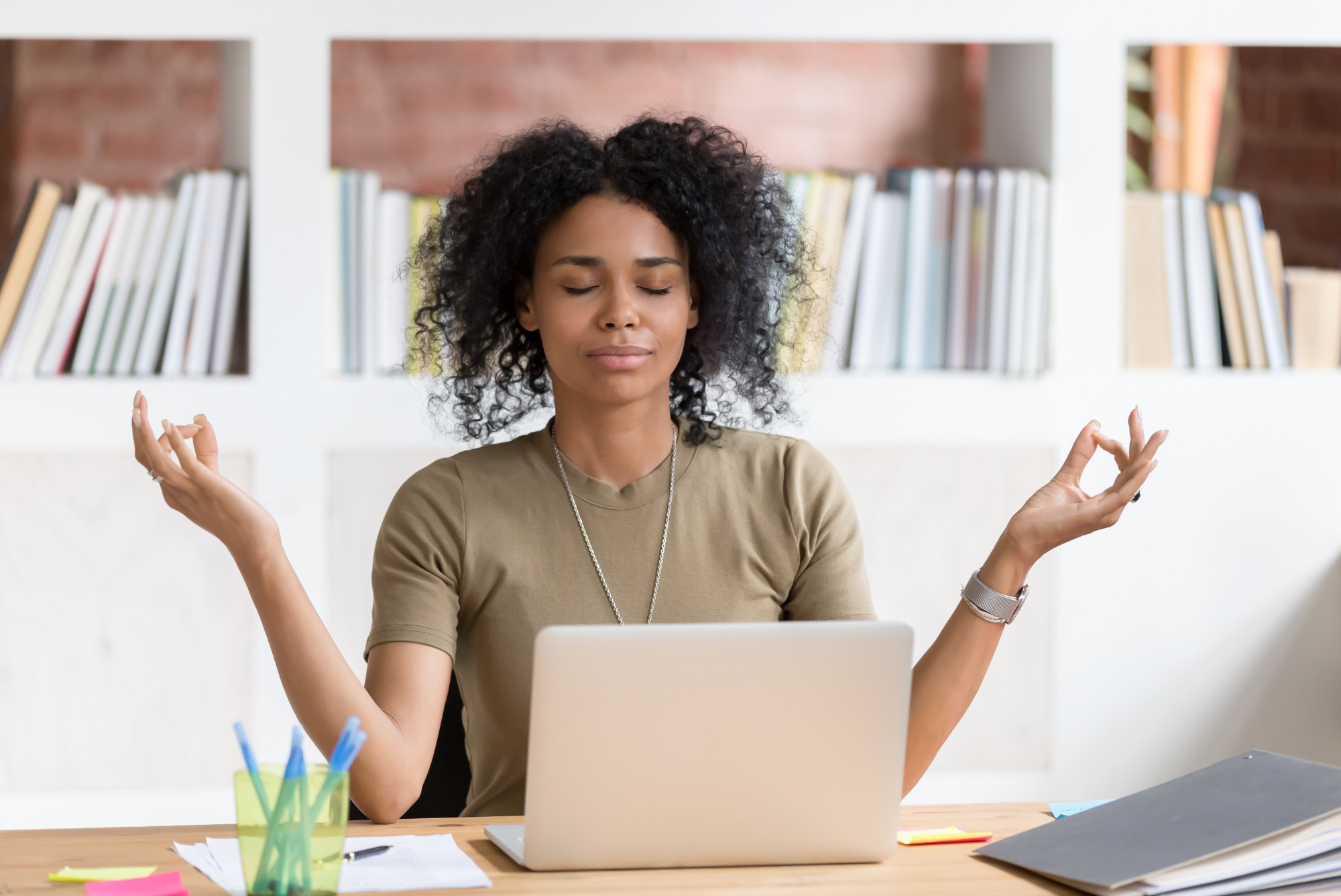 Woman professional practicing intuitive healing practice meditation, which is offered at our Friday Reset workshop.