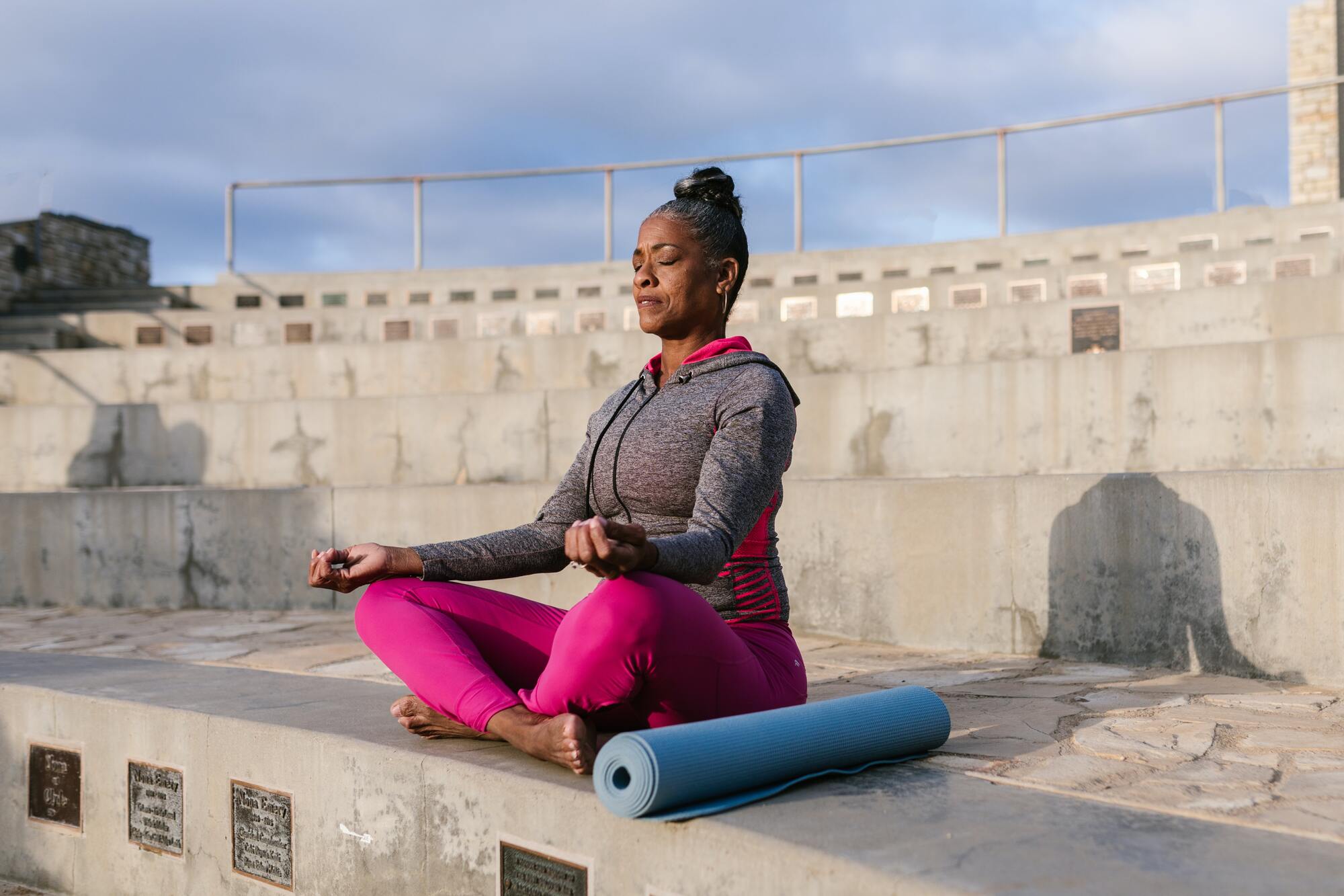 Woman practicing meditation stress management technique.